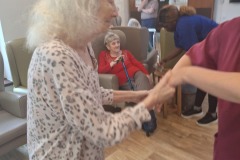 Singing and dancing at Charnley House care home in Hyde