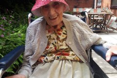 Sitting in the sunshine in the garden at nursing home in Hyde