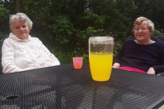 Sitting in the sunshine in the garden at nursing home in Hyde