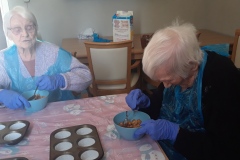 Baking cornflake cakes at care home Hyde