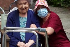 Residents in the sunshine at Charnley House care home in Hyde