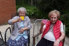 Residents in the sunshine at Charnley House care home in Hyde