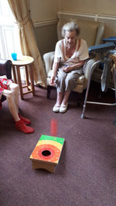 Residents playing the bean bag game at Chesterfield care home