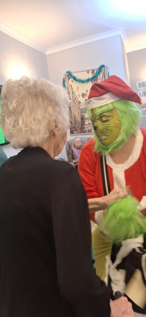 A visit from the Grinch at Charnley House care home in Hyde